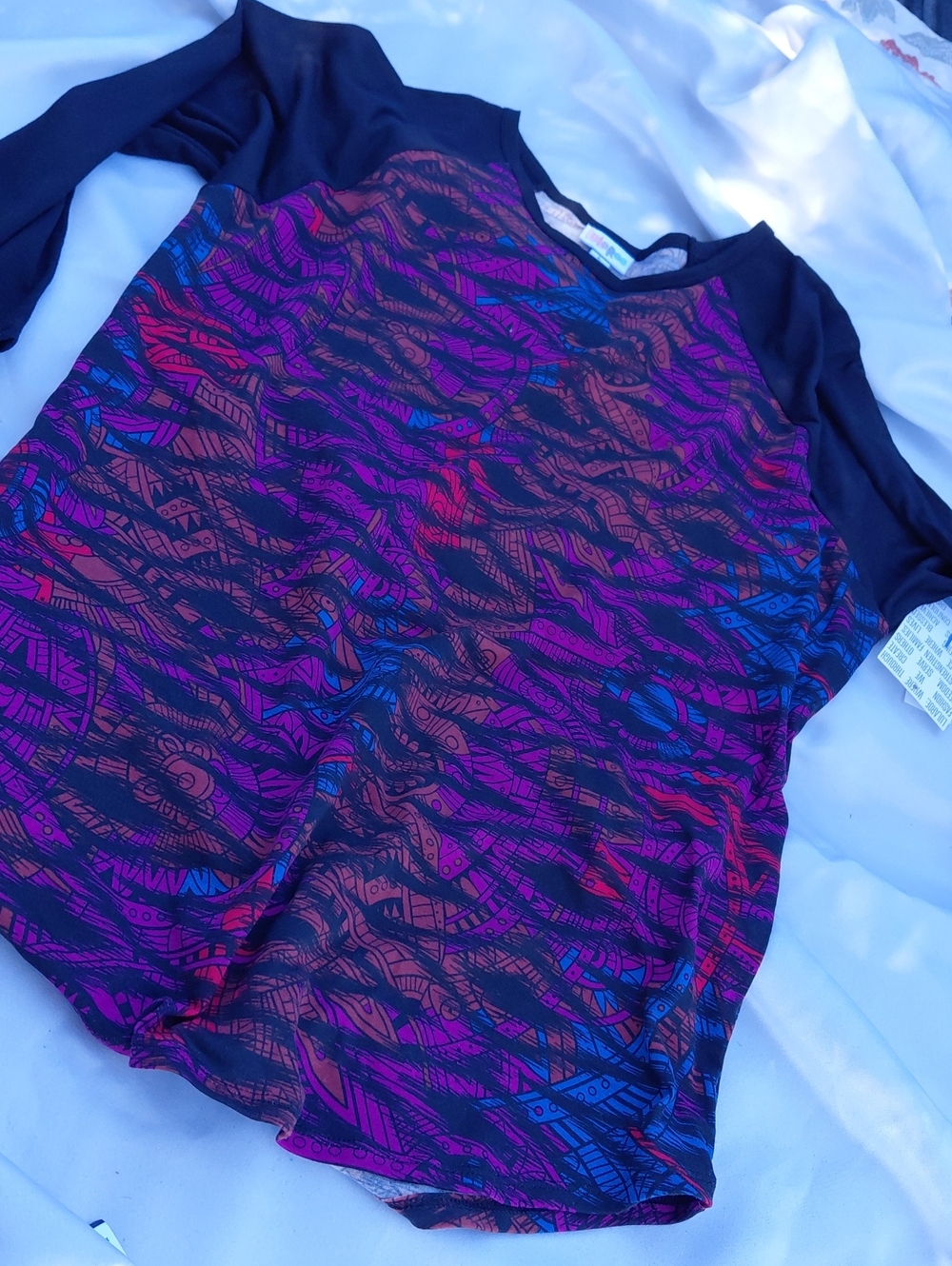 LuLaRoe Black Short Sleeve Top with Multicolor Abstract Waves